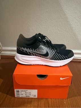 Nike Run Defy Women’s Black and White Athletic Sneakers